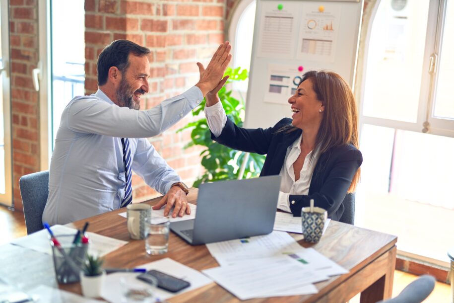 What is Customer Success? 1 men and woman celebrating customer success